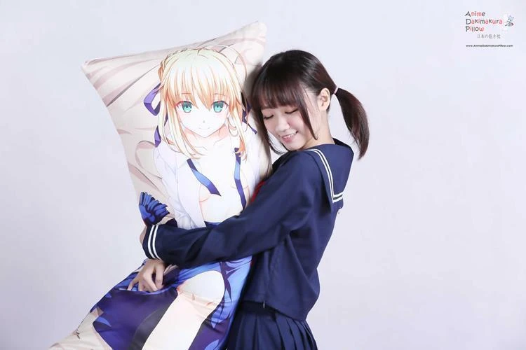 Girl in a sailor uniform hugging an anime dakimakura pillow