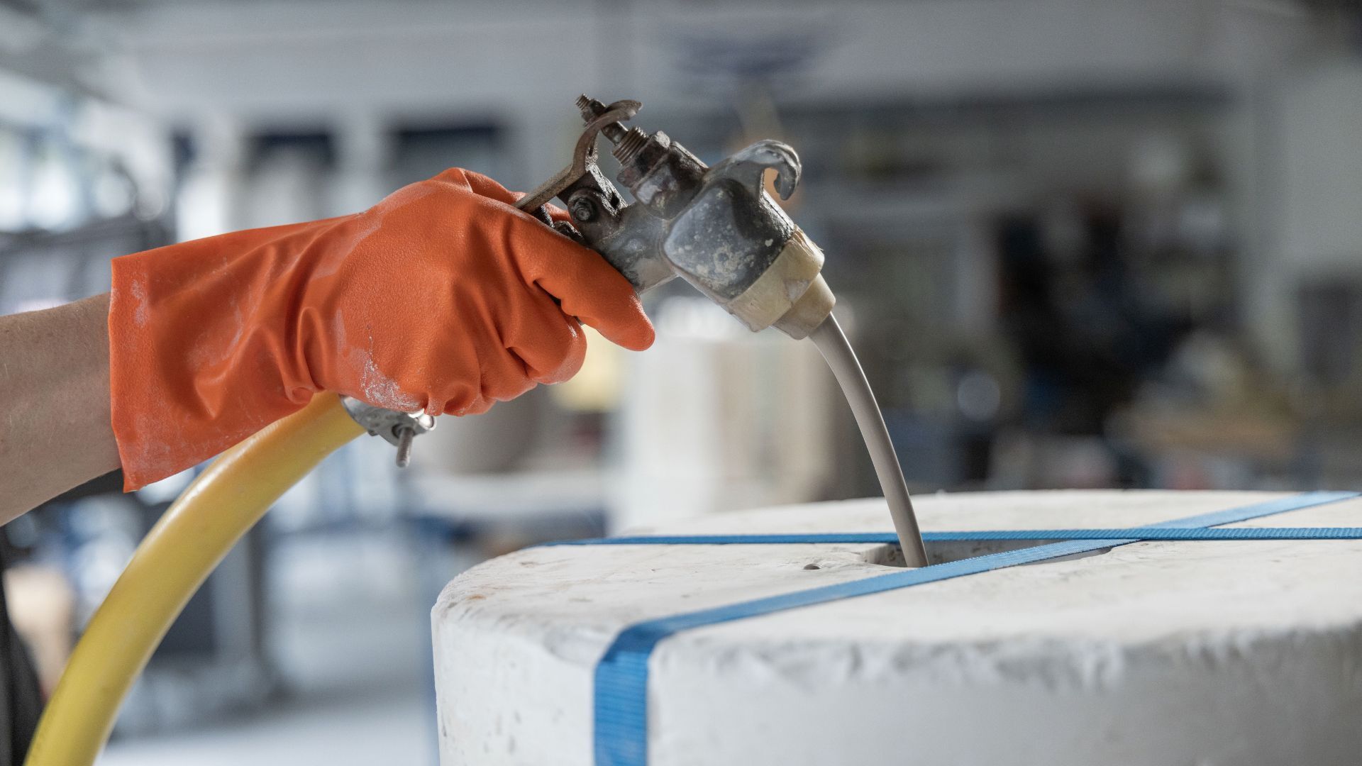 Liquid clay being poured into the plaster mould