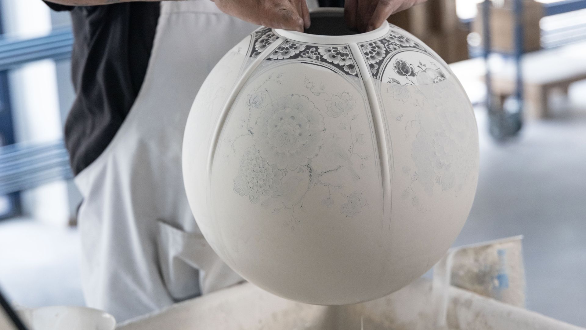 Piece being glazed by hand