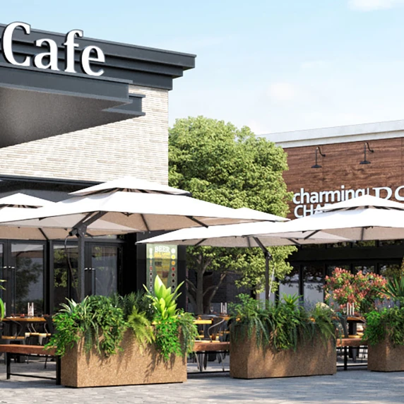 Old Elm Large Rectangle Planters in a commercial outdoor café setting with lush green plants