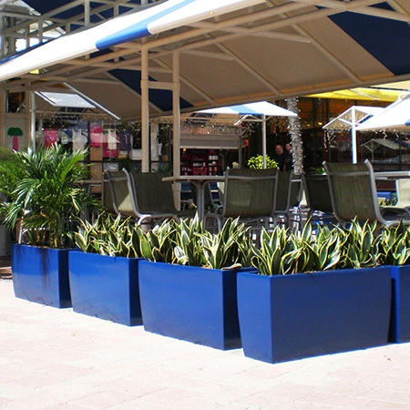 Lightweight durable fiberglass planters in custom commercial finishes