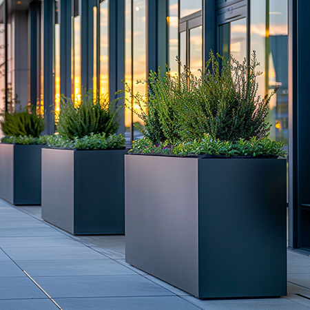 Large commercial fiberglass planters for building entries, rooftops, and amenity spaces