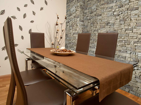 Beach Bluff faux wall panels in the Denver Dry Stack style used in a dining room.