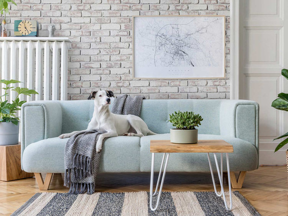 a faux brick wall installed in a living room using Old Medford faux brick wall panels