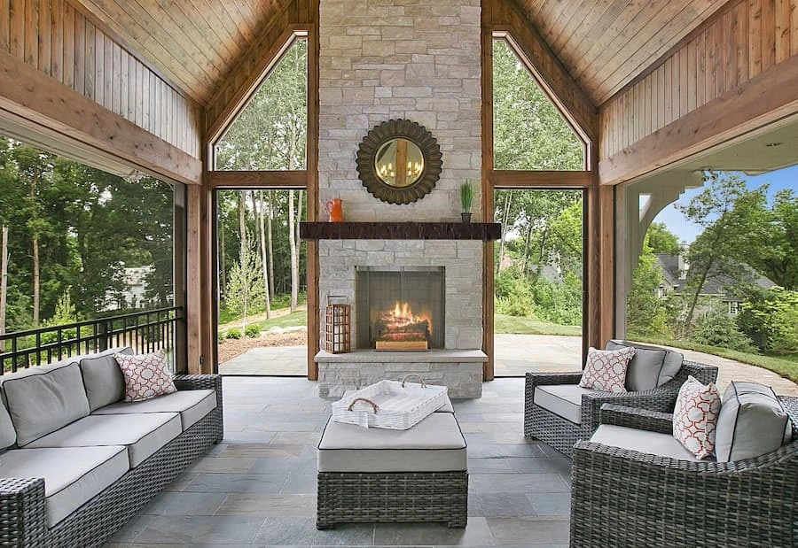 Covered patio with fireplace featuring Old Tuscan Faux Wood Mantel in Fresh Coffee.