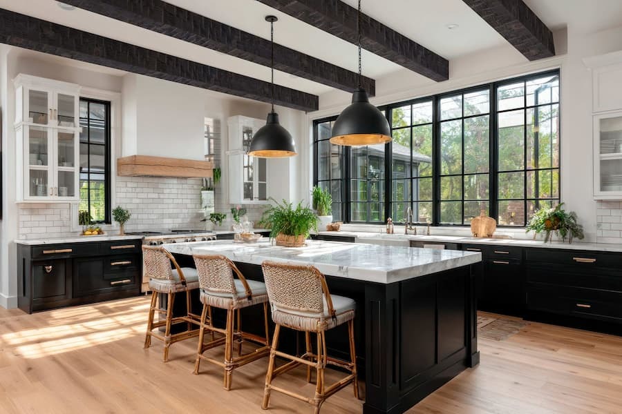 Modern kitchen and dining room area featuring Heavy Hand Hewn Natural Wood Beams in Roasted Brown.