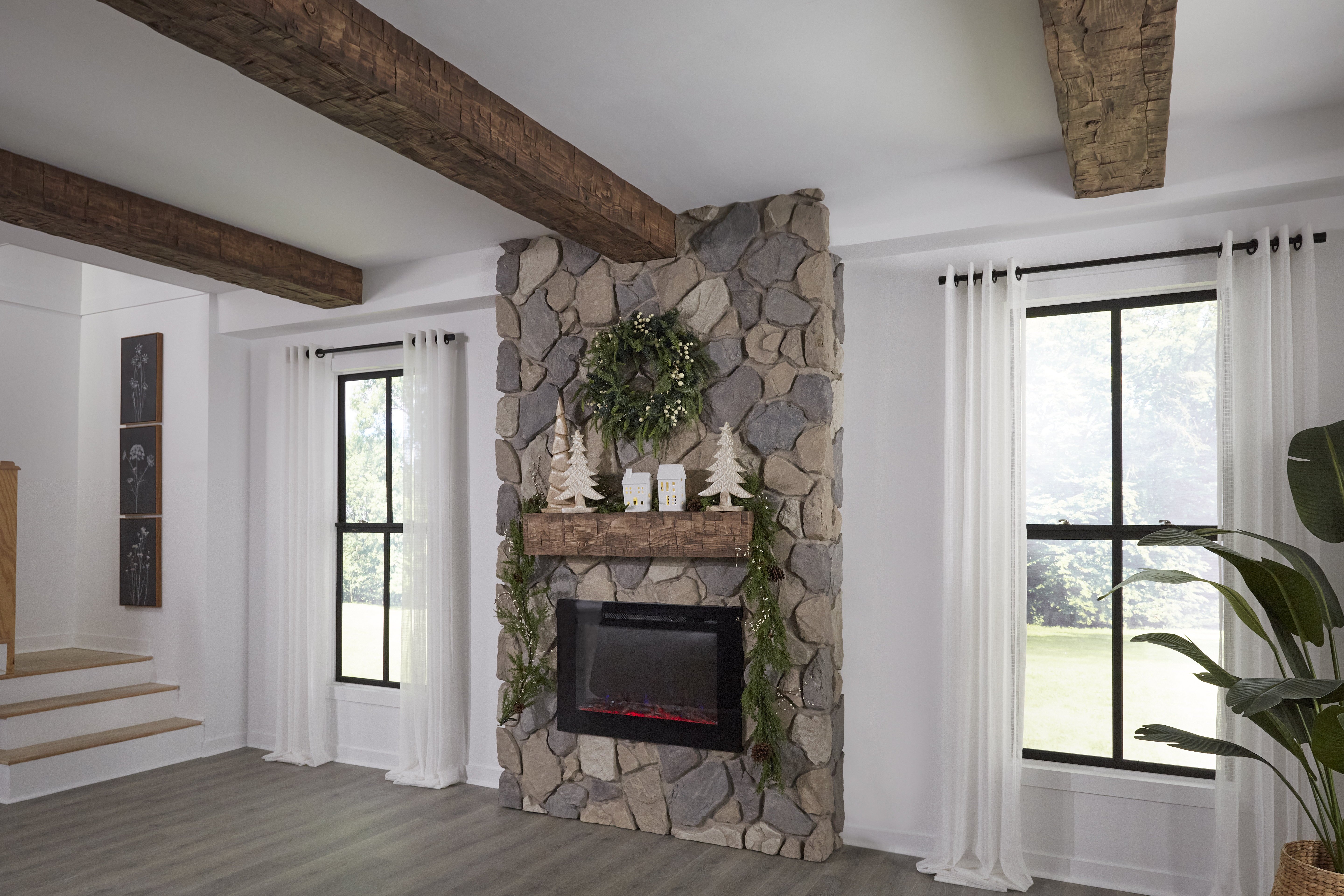 Fireplace featuring Old Tuscan Faux Wood Mantel in Cappuccino over stone panels.