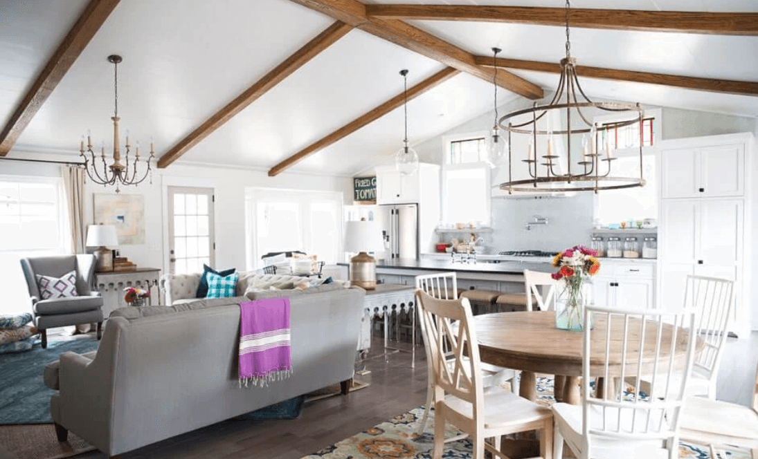 Faux beams on a vaulted ceiling ties together an open-concept space.