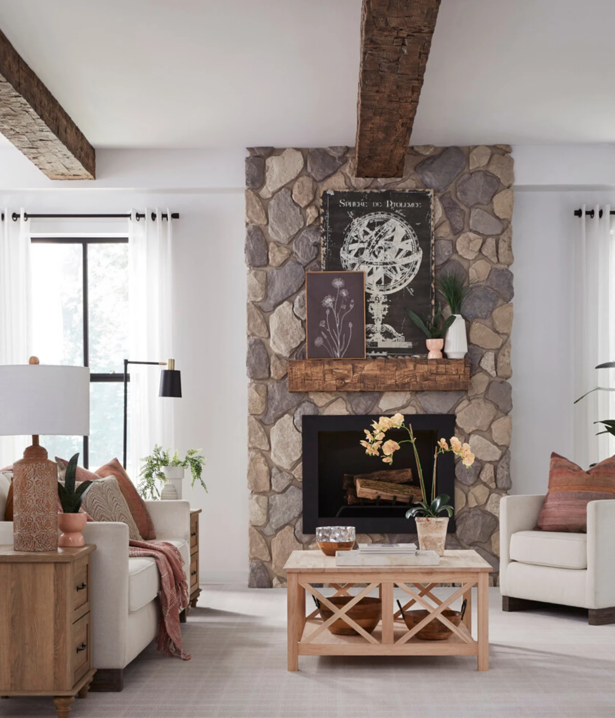 old tuscan beams and mantle in fireplace deisgn witj faux stone wall panels