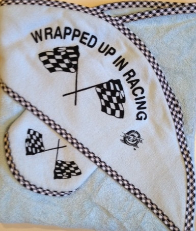 Adorable Baby towel and washcloth set

 "Wrapped Up In Racing"

 Light Blue towel with checker flag trim

 Great gift for a baby shower!

 Machine washable