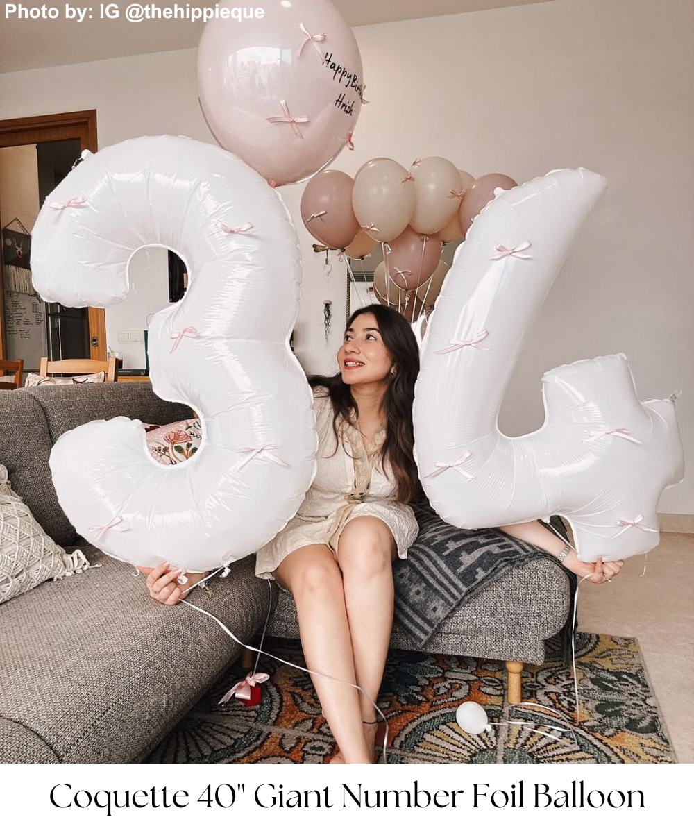 The more you celebrate your life, the more there is in life to celebrate! Add a touch of elegance and charm to your birthday, anniversary, or life milestone with our Giant Number Foil Balloons, now styled with delicate ribbon bows for a sweet coquette theme that’s trending right now. These beautifully adorned balloons make a big statement, with their bold numbers giving a shout out to a birthday age or a significant date. Perfect for adding a whimsical, stylish flair to 1st, 16th, 18th, 21st, 50th, 60th, 70th, 80th, 90th, or 100th birthday celebrations