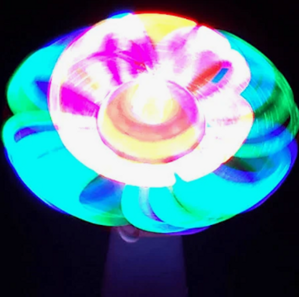 Glow Spinner light up fun. Switch adapted toy for people with disabilities.