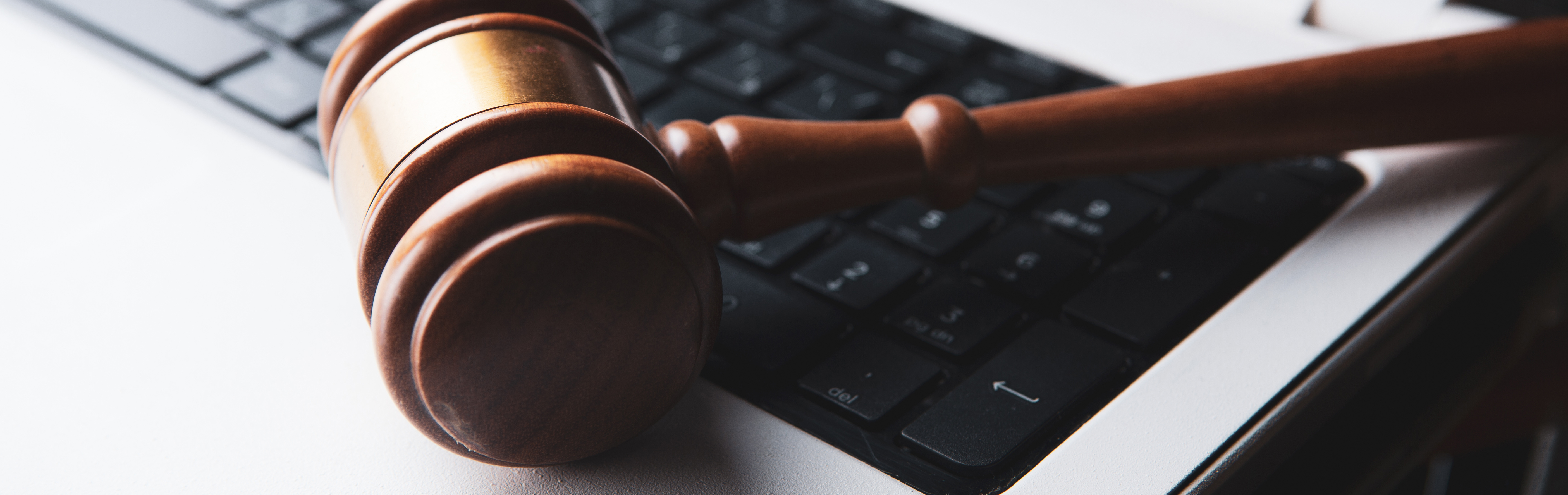 Gavel resting on a computer keyboard