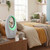 White bladeless fan with LED light on bedside table in modern bedroom