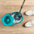 Grey and teal mop bucket with built-in spin wringer, top view.