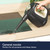 Handheld steam cleaner being used on a glass shower screen