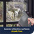 Handheld steam cleaner on window, leaving reflective surfaces streak-free