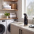 Cordless window vacuum cleaner on laundry room counter