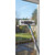 Window cleaning tool with microfiber pad and squeegee shown cleaning glass.