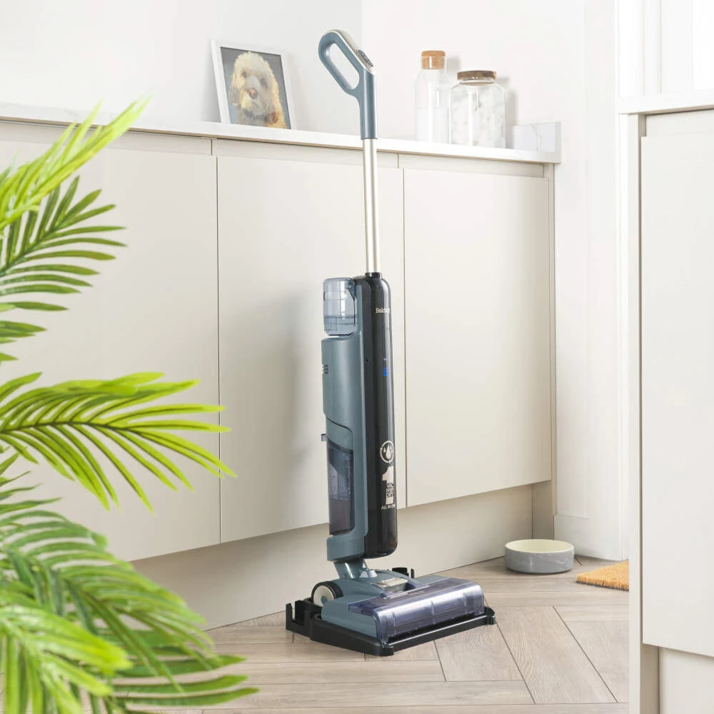 A floor cleaner in its storage base