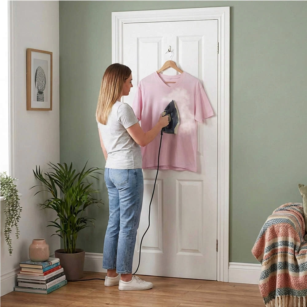 Ironing a tshirt on a door