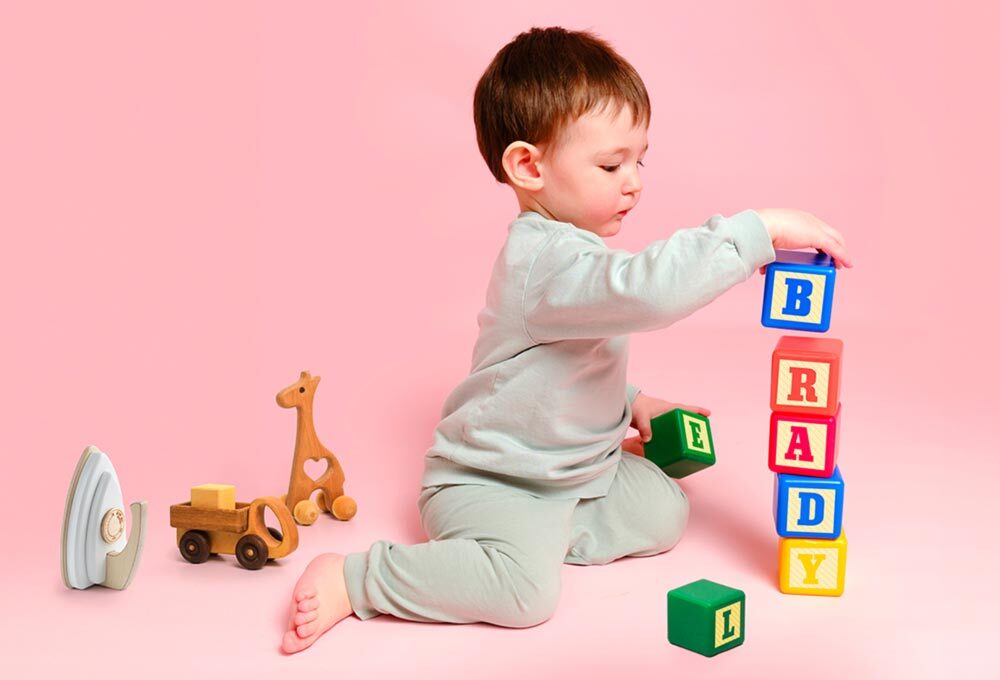 Child playing with toy blocks