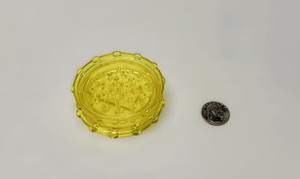 3.in DIA 2pc HARD ACRYLIC HERB GRINDER YELLOW, bright yellow acrylic grinder beside a coin.