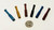2.5in SPIKED SMALL BAT HITTER in assorted colors, size comparison with a quarter shown.
