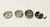 Silver 4pc HERB GRINDER METAL GRINDER with bottom view window and notched finger grips.