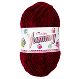 A 100g ball of Yummy Chunky Burgundy Polyester Yarn, manufactured by King Cole.