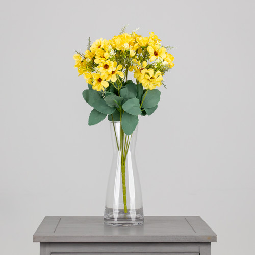 An artificial bunch of yellow daisies.