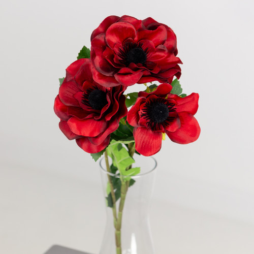 A red anemone spray, measuring 50cm. A red anemone spray, measuring 50cm.