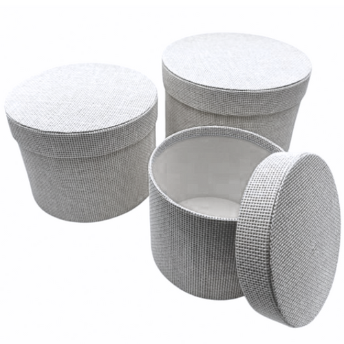 A Set of 3 White Round Textured Hat Boxes.