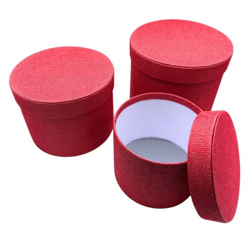 A Set of 3 Hot Pink Round Textured Hat Boxes. A Set of 3 Hot Pink Round Textured Hat Boxes.