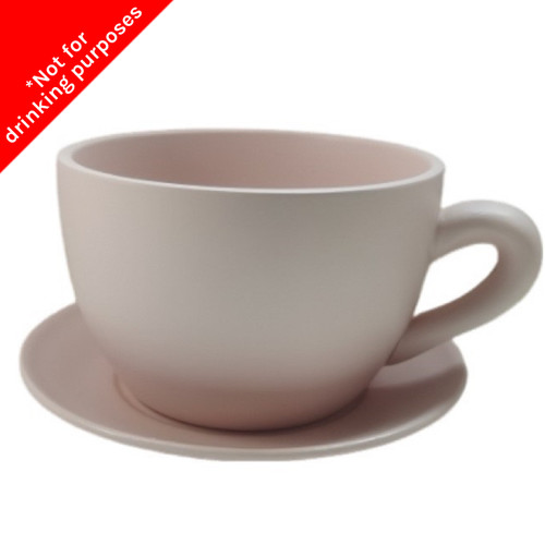 A Dusky Pink Ceramic Teacup with Saucer.