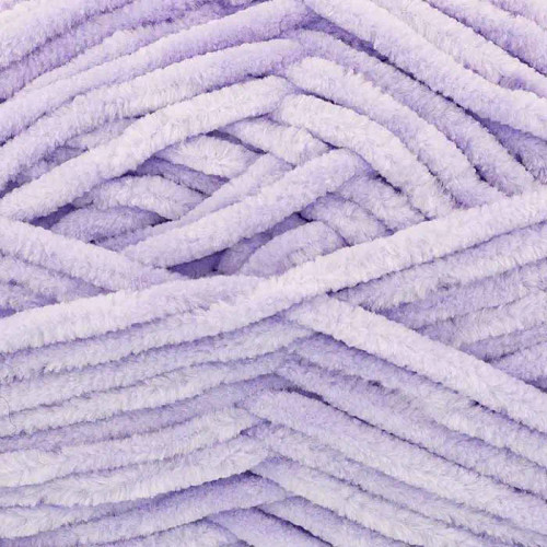 A 100g ball of Yummy Chunky Lilac Polyester Yarn, manufactured by King Cole.