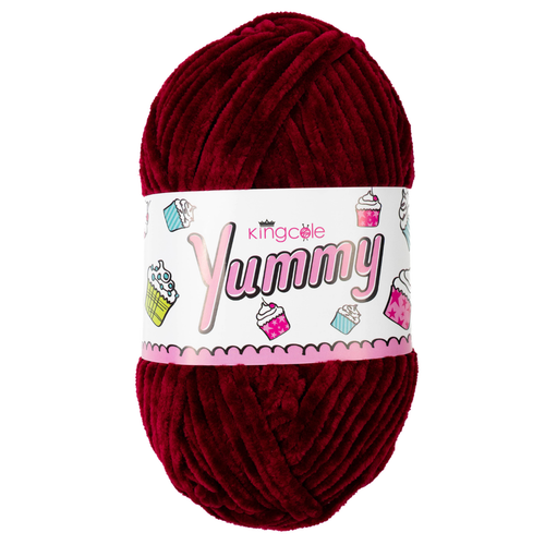 A 100g ball of Yummy Chunky Burgundy Polyester Yarn, manufactured by King Cole.