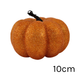 A 10cm orange glittered pumpkin.