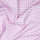 A 110cm x 100cm pre-cut piece of baby pink 6mm gingham polycotton fabric.