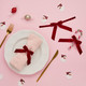 A pack of 6 Red Velvet Bow Tie Decorations.