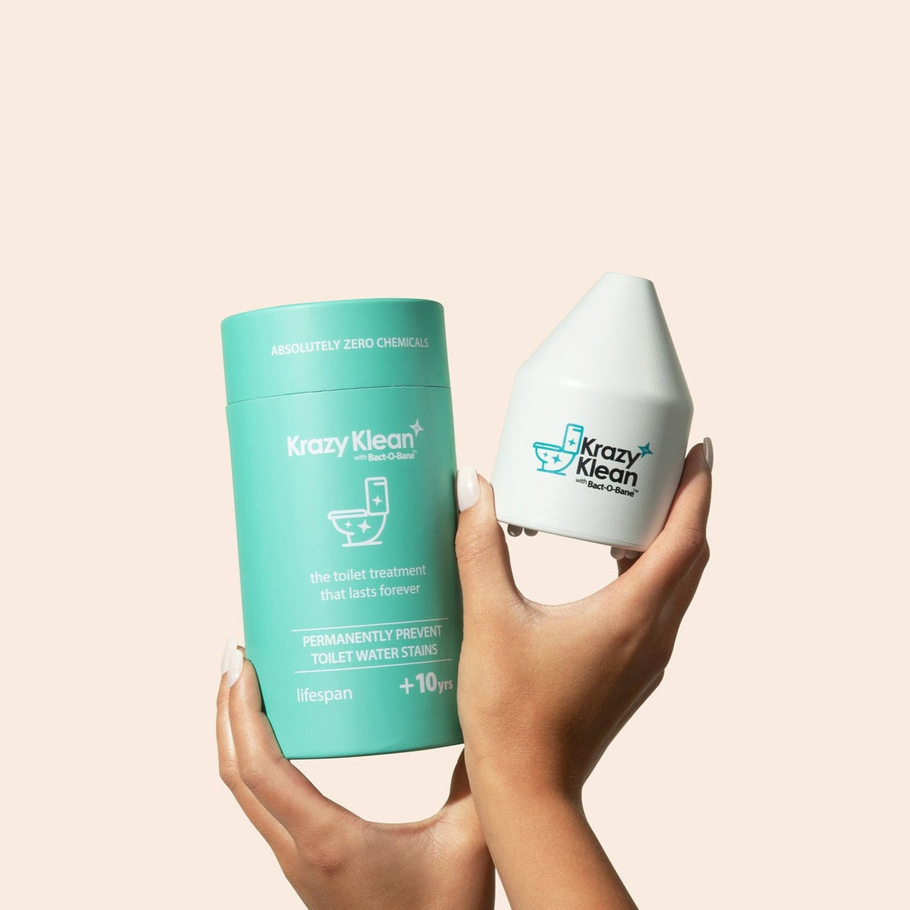 A hand holding Krazy Klean toilet cartridges