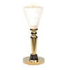 Brass torchiere table lamp with white shade.