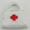 Tiny white painted metal nurse's bag with red cross