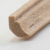 Cross section photograph of half-inch scale (1/4" high) crown cornice basswood trim