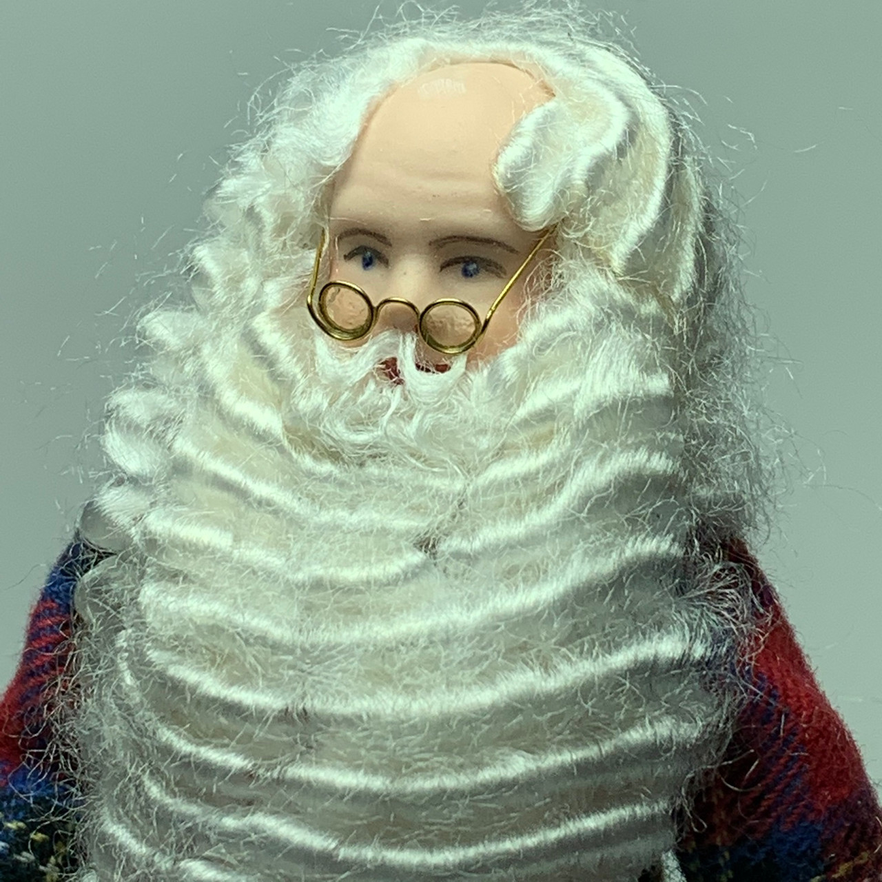 With his furrowed brow and eyeglasses near the tip of his nose, you can easily see that Santa is hard at work!