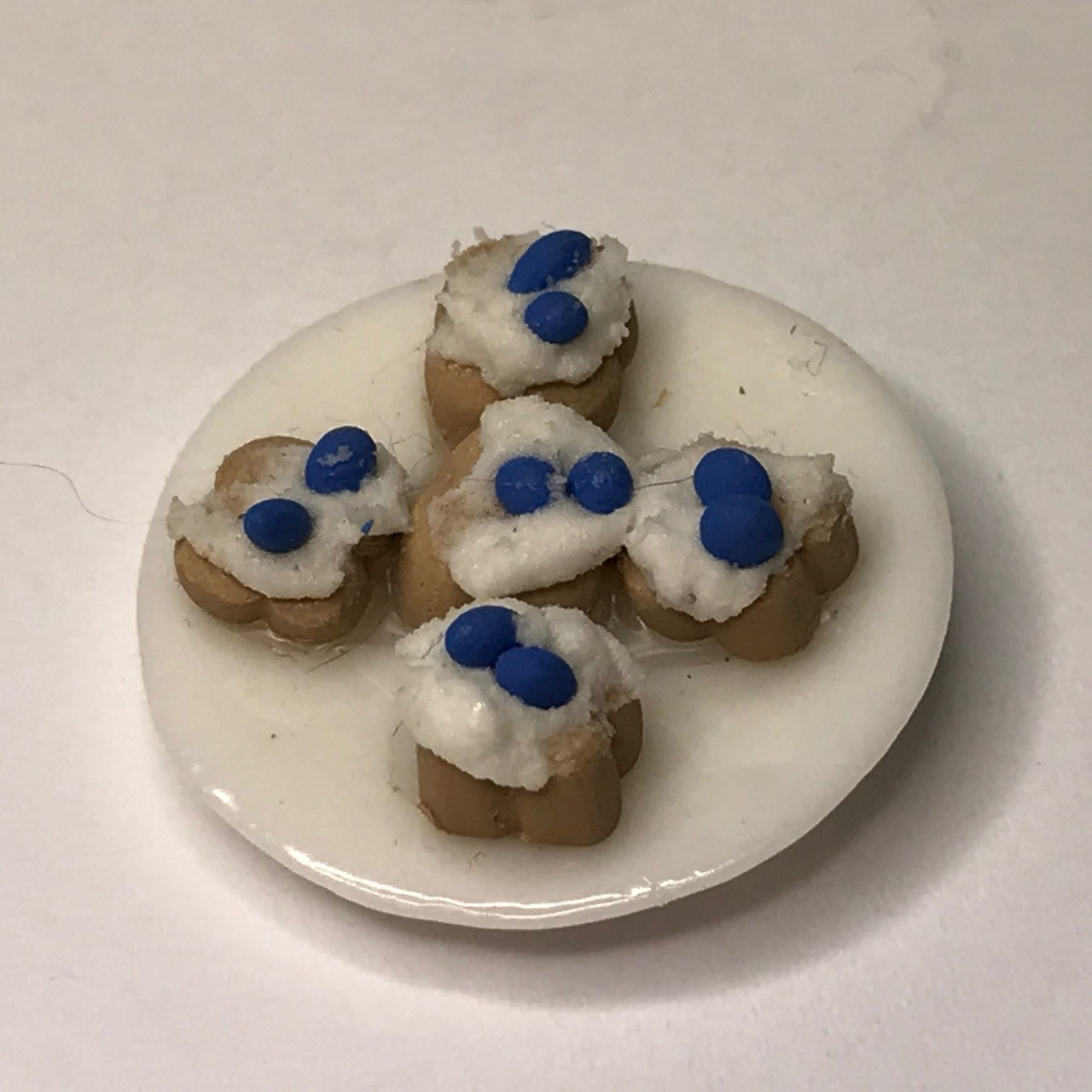 Blueberry tarts on white ceramic plate