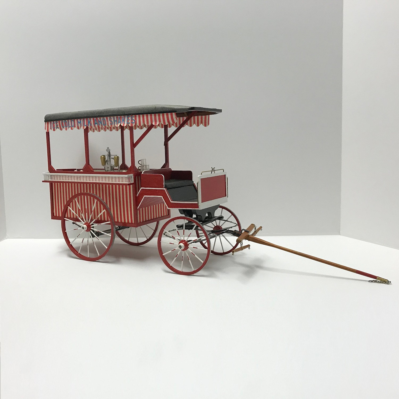 One-inch (1:12) scale dollhouse miniature ice cream wagon (circa 1895) long shot
