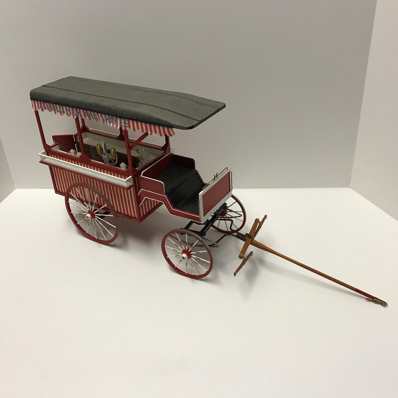 One-inch (1:12) scale dollhouse miniature ice cream wagon (circa 1895) long shot 2