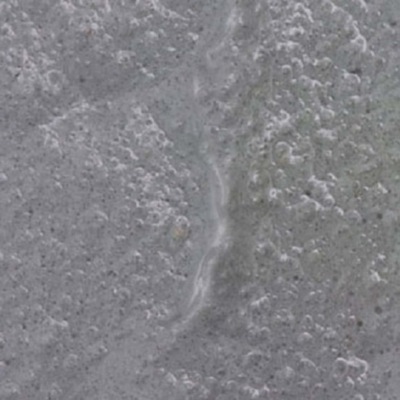 Image of "puddle" of gray mortar