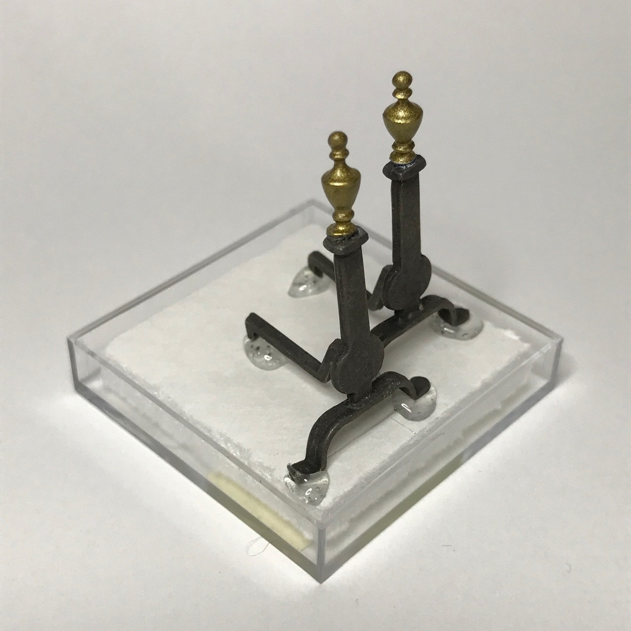 Black andirons w/brass finials (shown partially packaged for shipping)